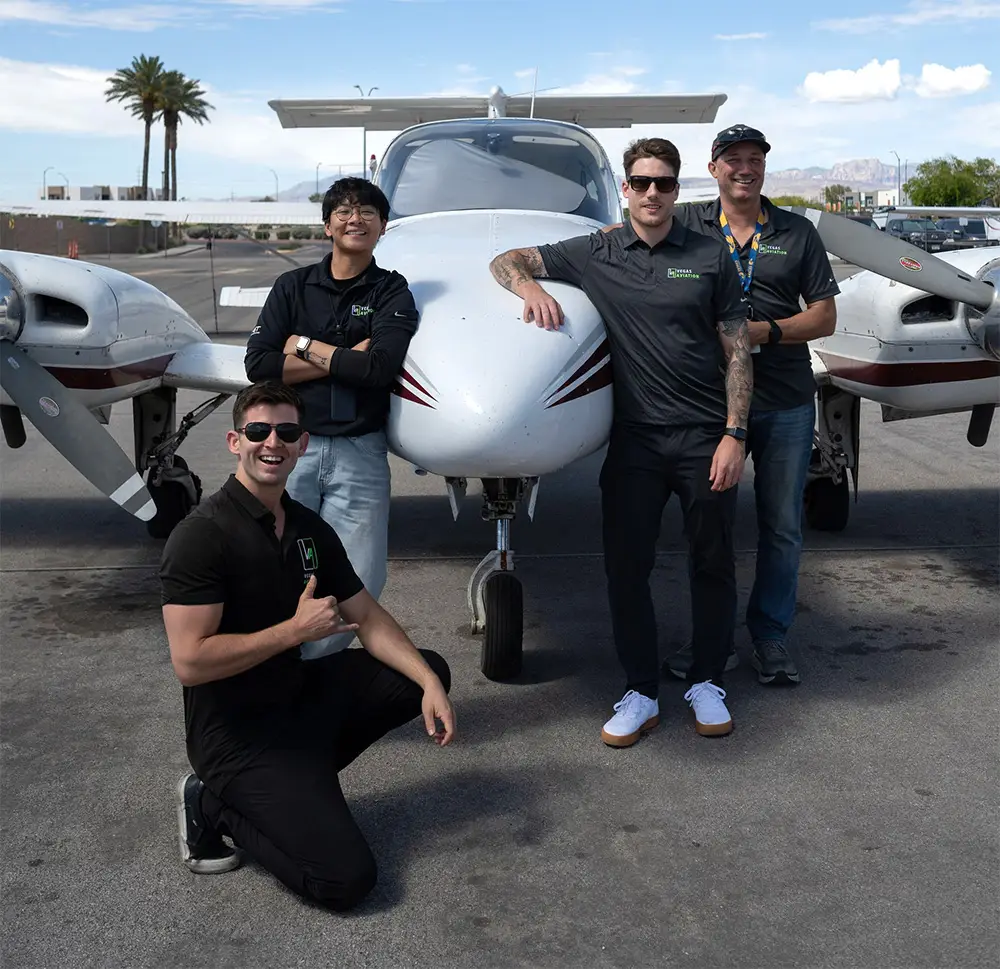 Part of Vegas Aviation's CFI team in front of a plane