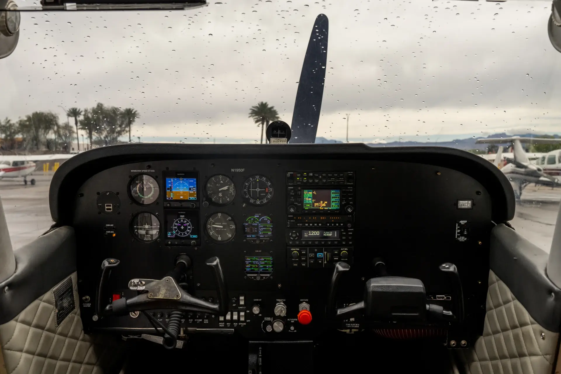 A pilot viewing the runway environment at North Las Vegas Airport during an instrument approach