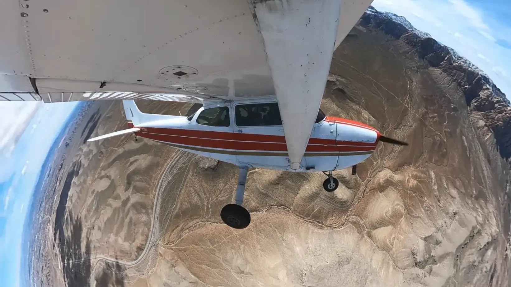 Airplane flying over canyon during introductory flight training