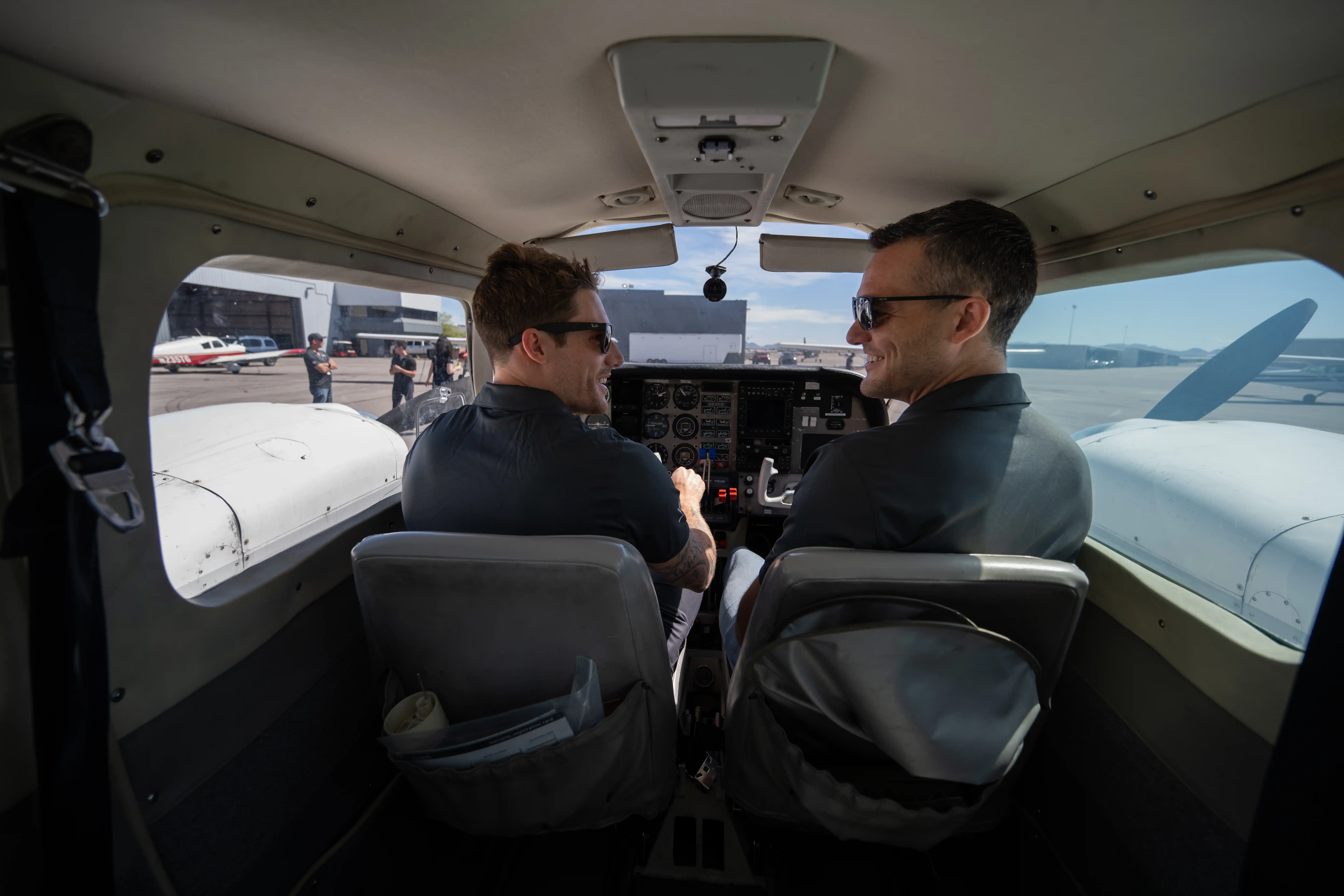 Student pilot and flight instructor training in an airplane cockpit