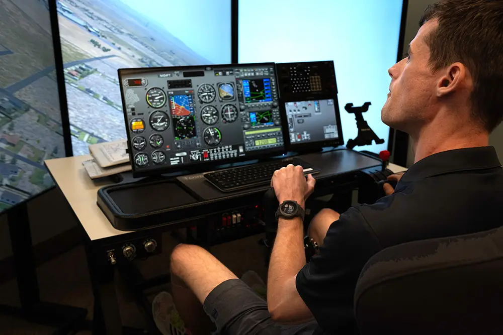 Backview of a man using Vegas Aviation's Flight Simulator