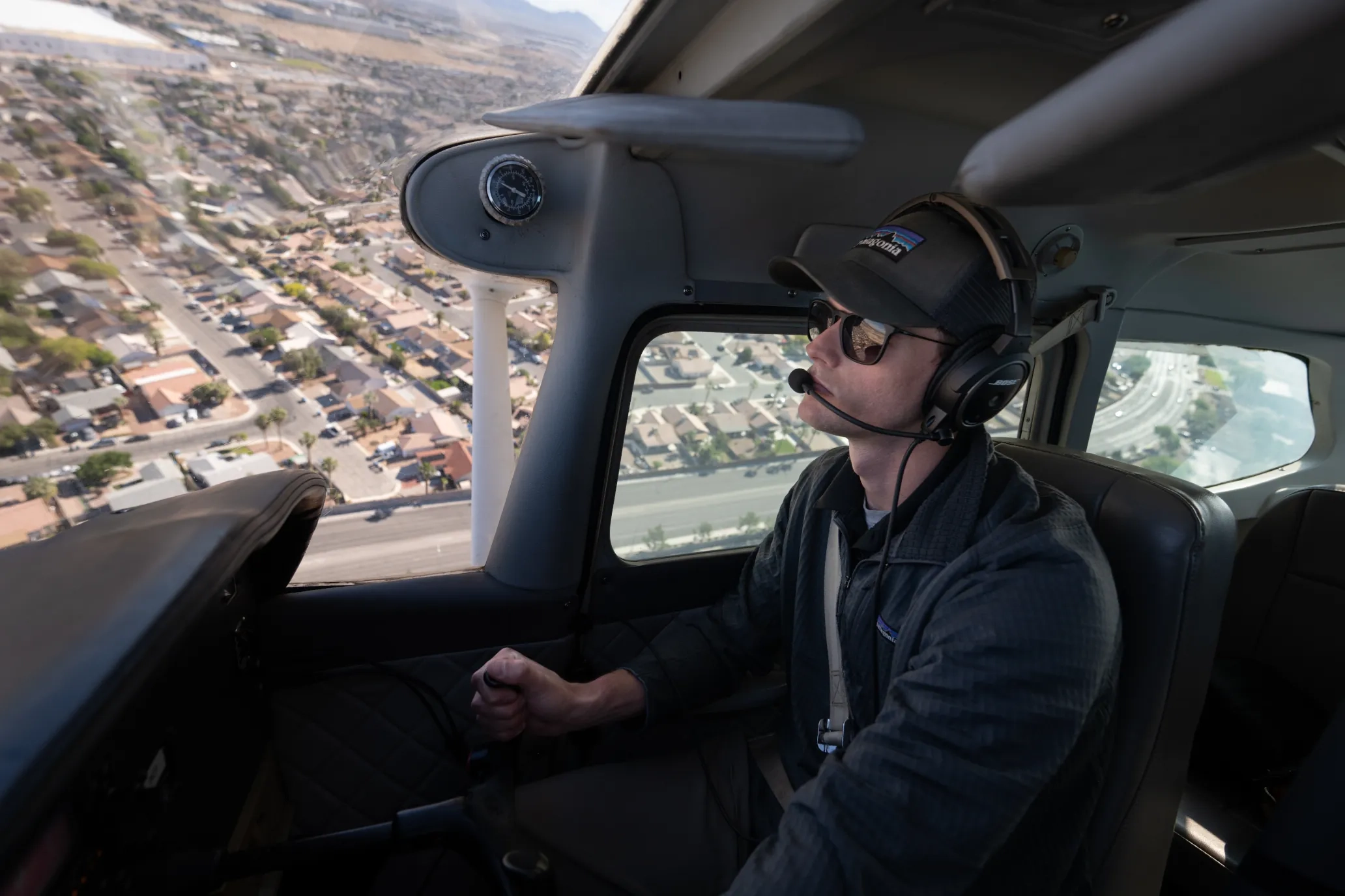 Pilot flying over a city