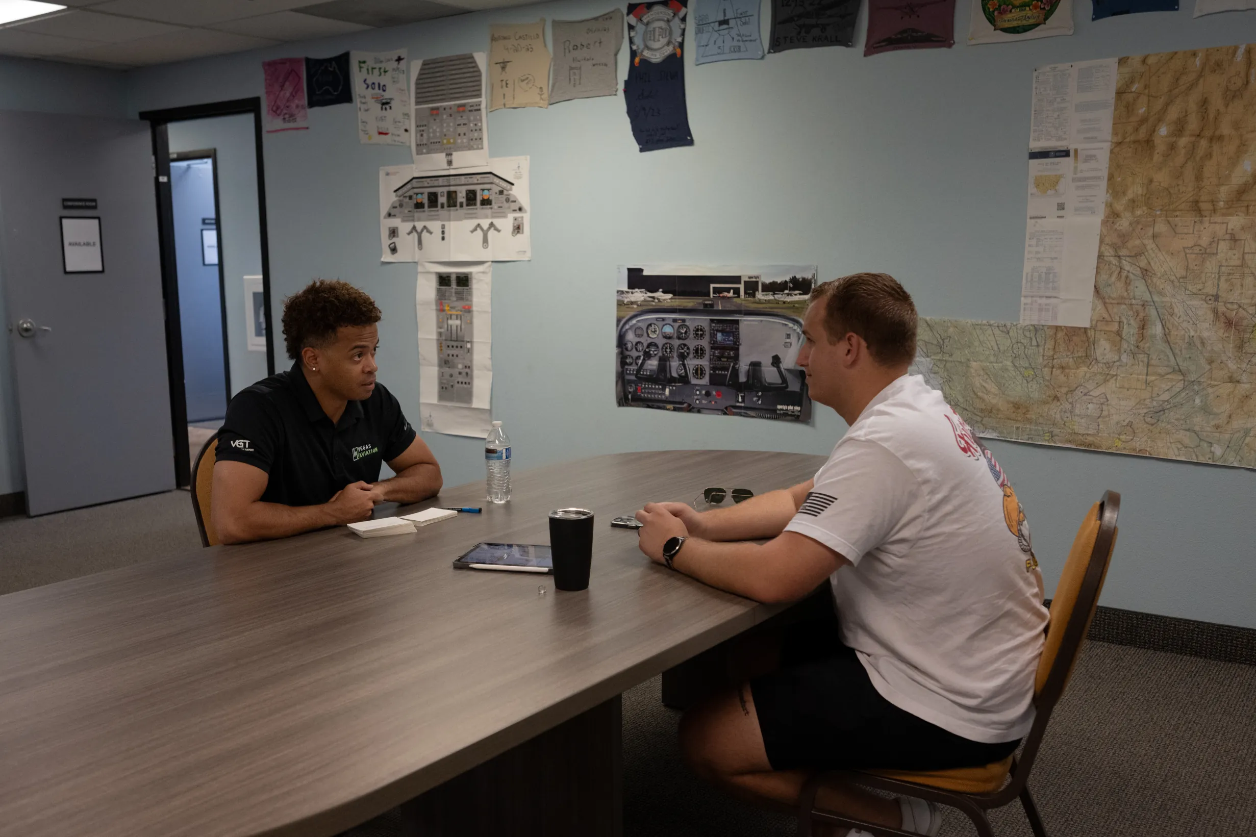Vegas Aviation instructor and student planning a flight training lesson indoors